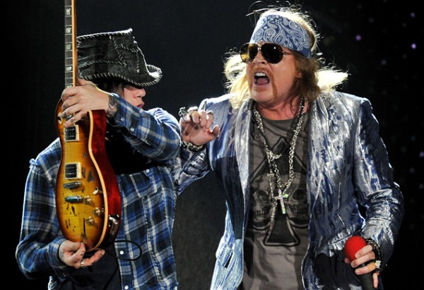 U.S. band Guns N' Roses guitarist DJ Ashba, left, and singer Axl Rose perform on their first night at London's O2 Arena, on Wednesday, Oct. 13 2010. (AP Photo/Mark Allan)