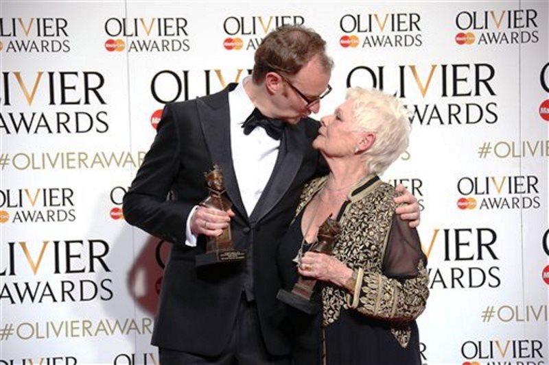 Actors Mark Gatiss, left, with his Best Actor in a Supporting Role award for his performance in the play 'Three Days in the Country' and Dame Judi Dench with her Best Actress in a Supporting Role award for her performance in the play 'The Winter's Tale' at the Olivier Awards in London, Sunday, April 3, 2016. (Photo by Joel Ryan/Invision/AP)