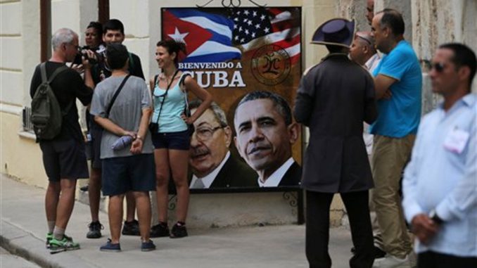 turistas poster Obama y Castro