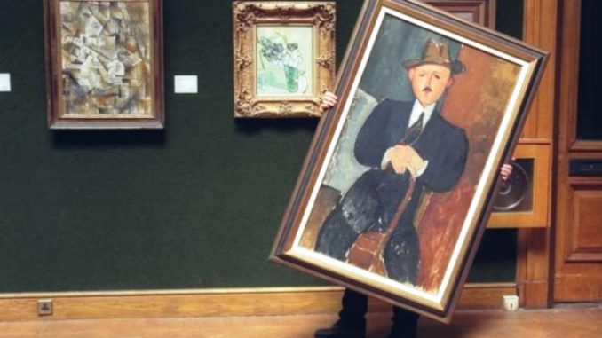Modigliani-hombre sentado con bastón