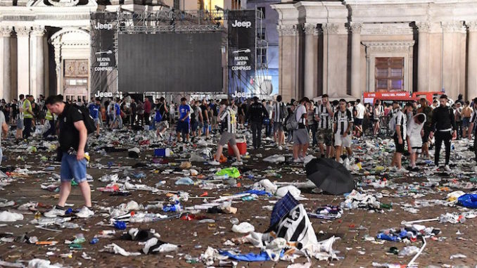 People flee San Carlos Square during a televised viewing of the Champions League Final after false reports of a bomb