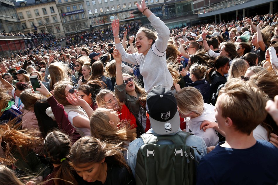 Fans of Avicii gather to honour him in central Stockholm