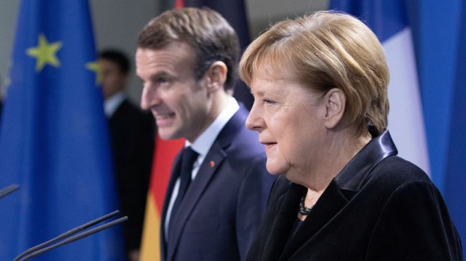 German Chancellor Angela Merkel welcomes French President Emmanuel Macron