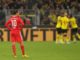 Dortmund (Germany), 08/10/2022.- Bayern's Leroy Sane reacts as Dortmund players celebrate their 2-2 equalizer during the German Bundesliga soccer match between Borussia Dortmund and Bayern Munich in Dortmund, Germany, 08 October 2022. (Alemania, Rusia) EFE/EPA/FRIEDEMANN VOGEL CONDITIONS - ATTENTION: The DFL regulations prohibit any use of photographs as image sequences and/or quasi-video.