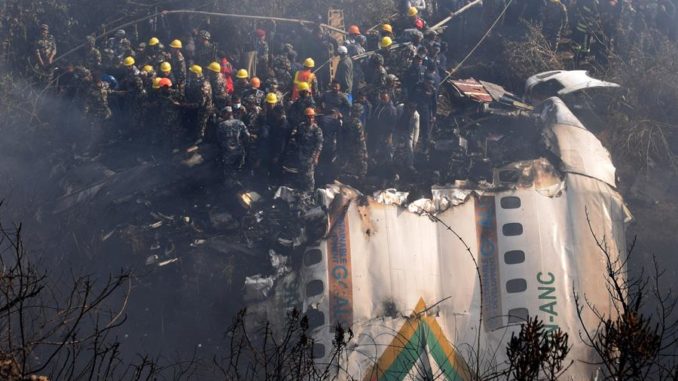 Pokhara (Nepal), 14/01/2023.- Rescue teams working near the wreckage at the crash site of a Yeti Airlines ATR72 aircraft in Pokhara, central Nepal, 15 January 2023. A Yeti Airlines ATR72 aircraft carrying 72 people on board, 68 passengers and 4 crew members, crashed into a gorge while trying to land at the Pokhara International Airport. According to a statement from the Civil Aviation Authority of Nepal (CAAN), at least 68 people were confirmed dead. EFE/EPA/KRISHNA MANI BARAL