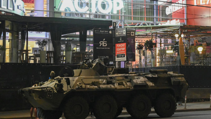 An armoured personnel carrier (APC) is seen next to a shopping mall in the southern city of Rostov-on-Don
