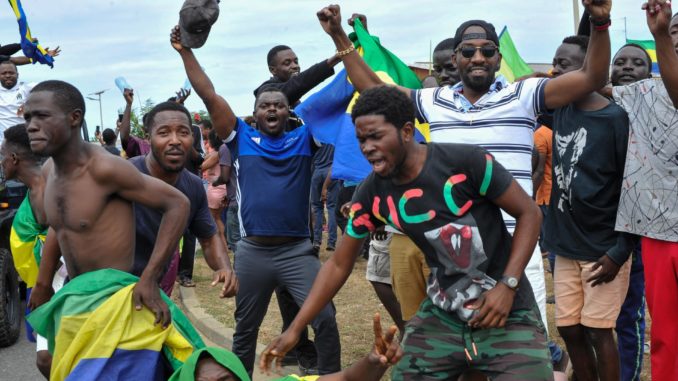 People celebrate the military coup in Gabon