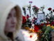 Moscow (Russian Federation), 01/03/2024.- A portrait of late Russian opposition leader Alexei Navalny sits amid flowers at a makeshift memorial outside the Borisovskoye cemetery following his funeral ceremony, in Moscow, Russia, 01 March 2024. Outspoken Kremlin critic Navalny died aged 47 in an arctic penal colony on 16 February 2024 after being transferred there in 2023. The colony is considered to be one of the world's harshest prisons. (Rusia, Moscú) EFE/EPA/MAXIM SHIPENKOV
