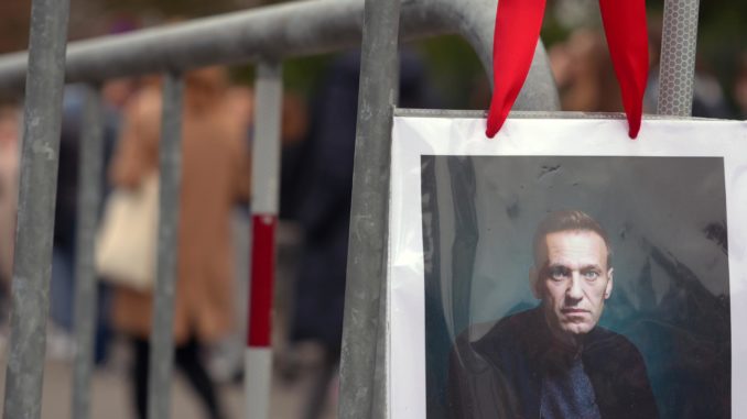 Russian queue at Russian embassy in Bern to vote and protest amid presidential elections