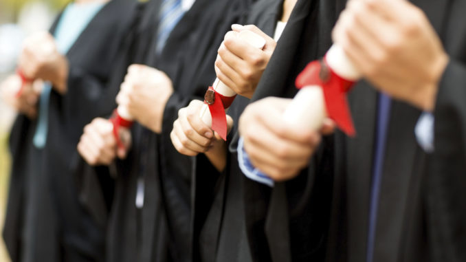 Midsection Of Students Holding Certificates On Graduation Day TECH Universidad ofrece un amplio catálogo de programas online que cumplen con altos estándares de calidad