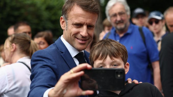 French President Macron votes in snap parliamentary elections