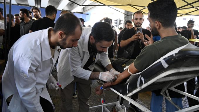 People donate blood one day after pagers explosions in Lebanon
