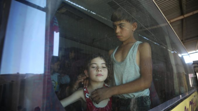 Displaced Syrians who fled the conflict in Lebanon arrive in Idlib, northern Syria