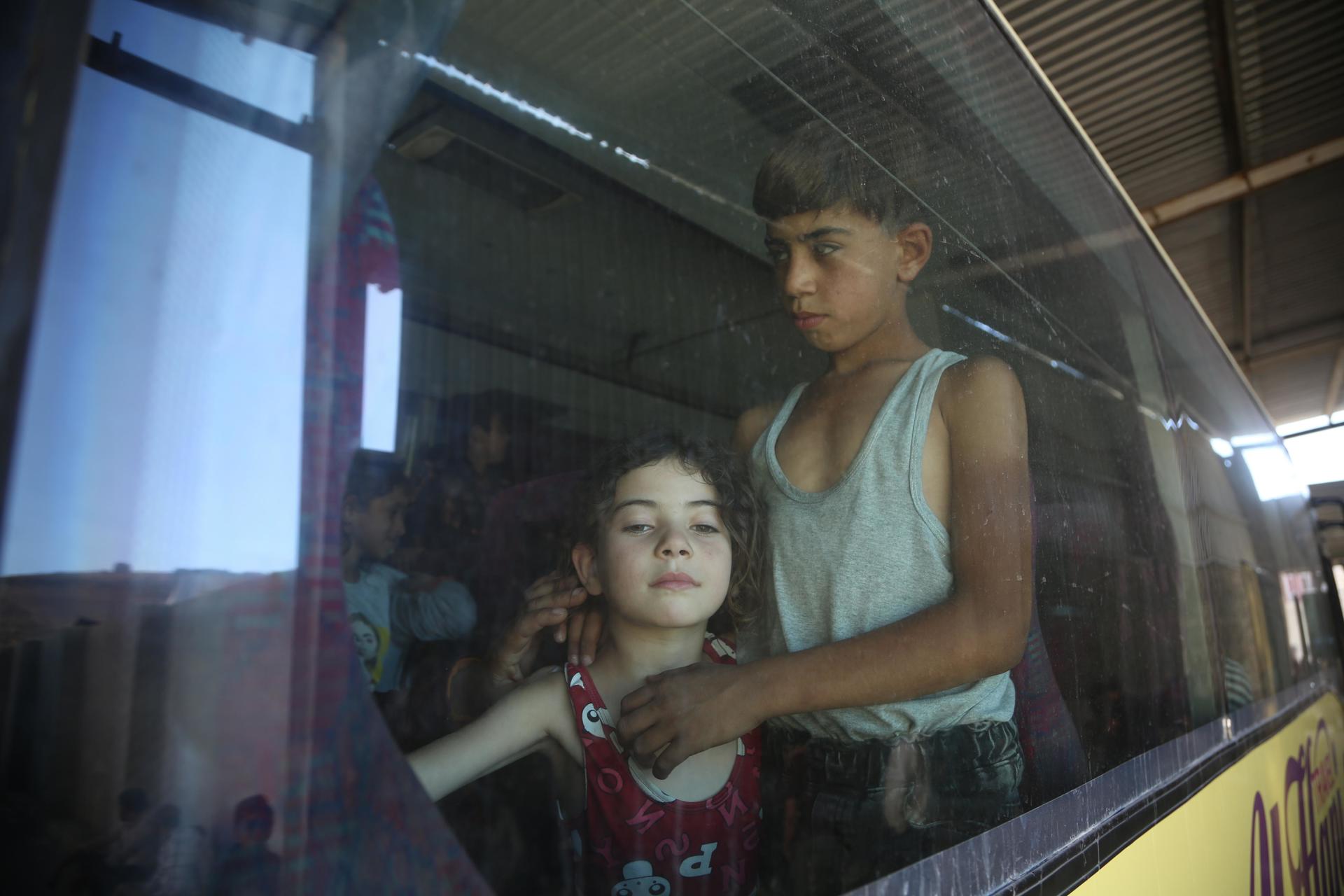 Displaced Syrians who fled the conflict in Lebanon arrive in Idlib, northern Syria
