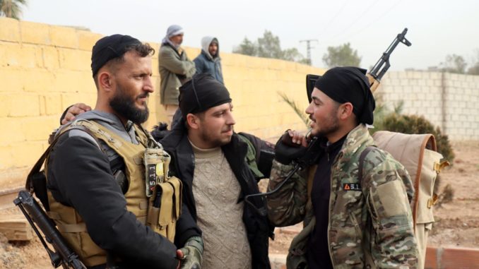 Kurdish volunteers patrol Qamishli, Syria