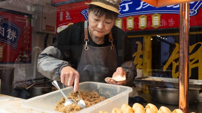China's inflation falls into negative territory for the first time in a year