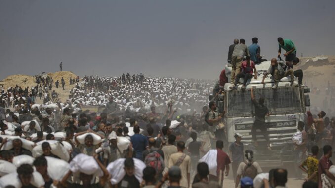 Aid enters Gaza Strip after Israel announces daily pause of hostilities